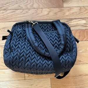 Happ Diaper Bag - lots of pockets inside. Side pocket for cell phone